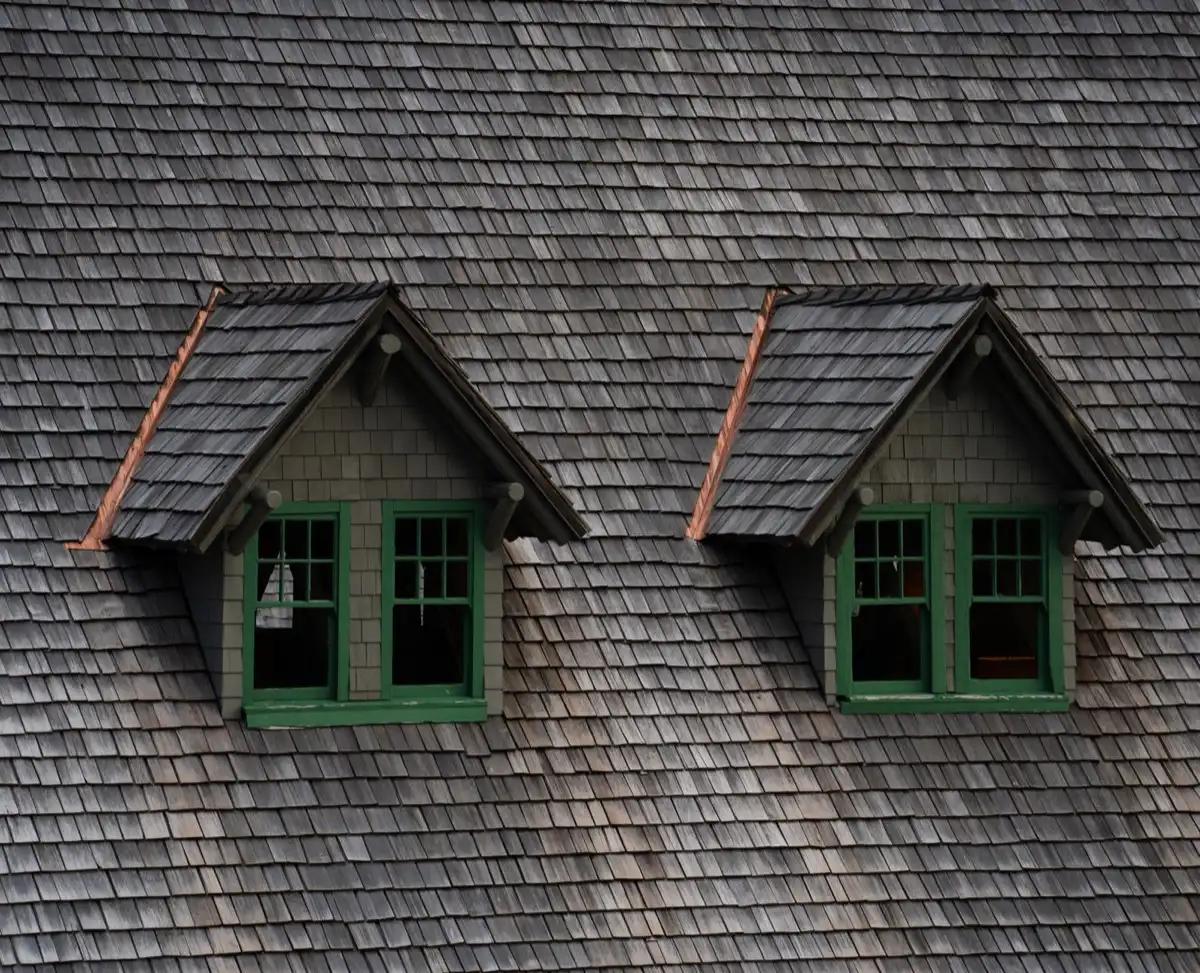 Dormers on a shingle roof in Waukegan, IL, where step flashing and kickout flashing carry water past the walls